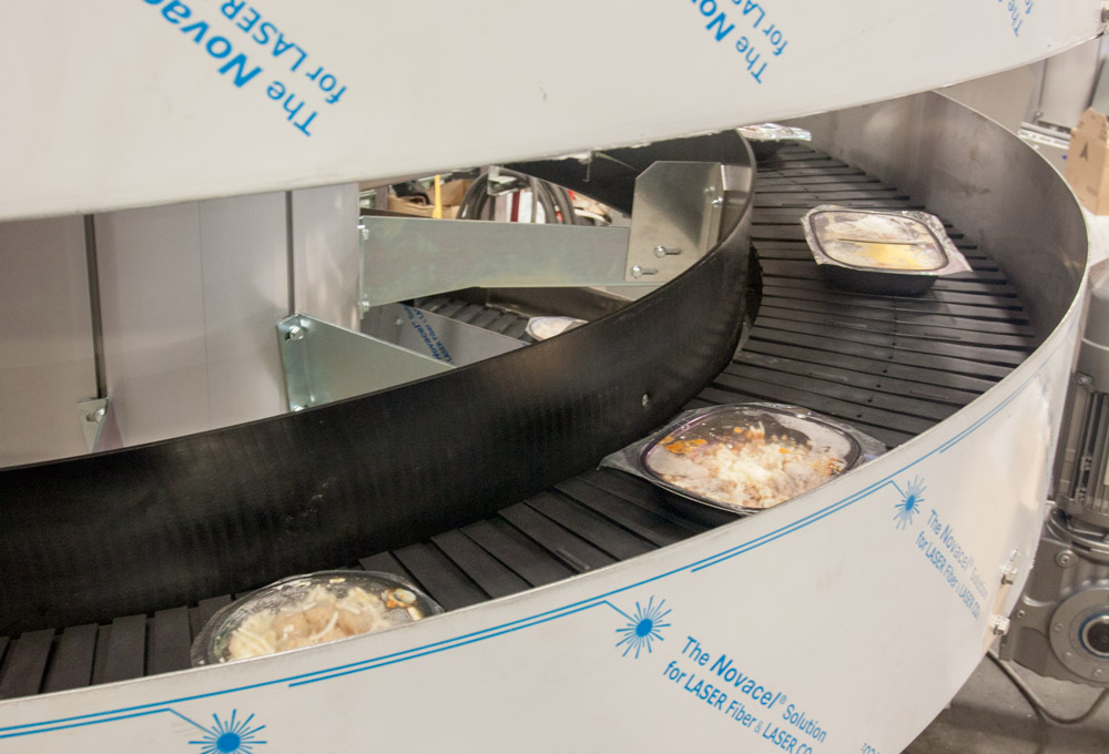 Ryson Spiral Conveyors conveying frozen food trays 